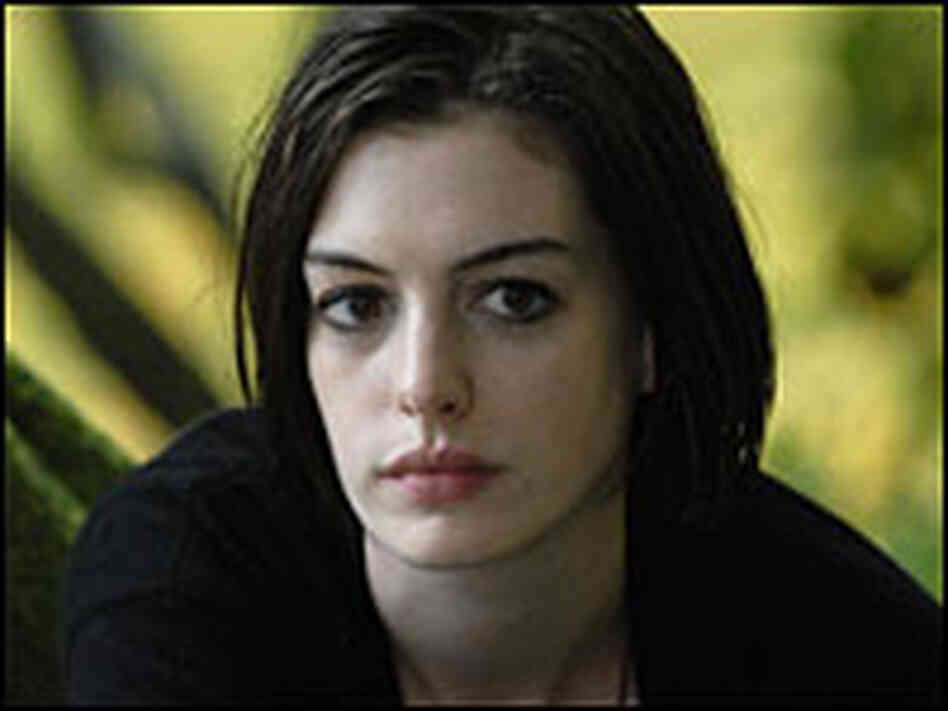 Anne Hathaway looks melancholy