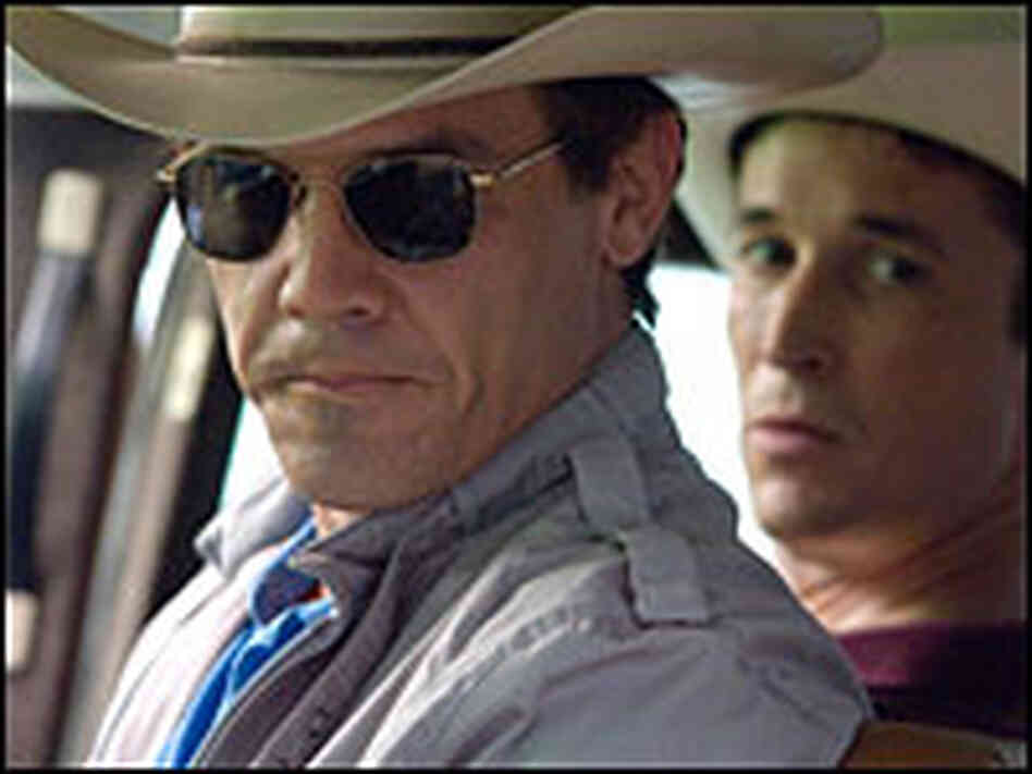 Brolin as Bush with cowboy hat.