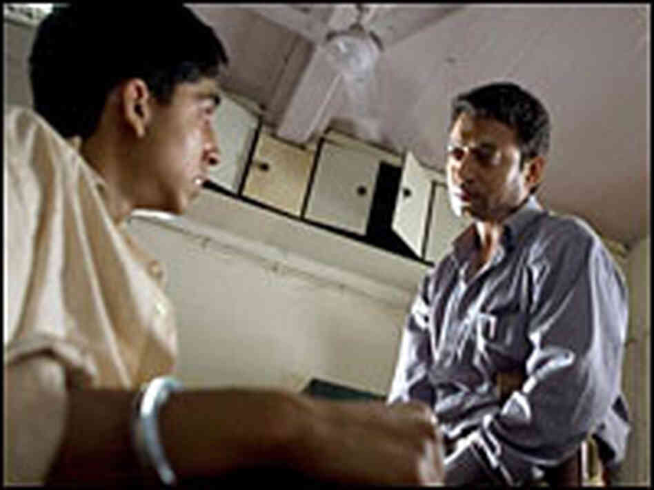 Jamal Malik and Irfan Khan as Police Inspector