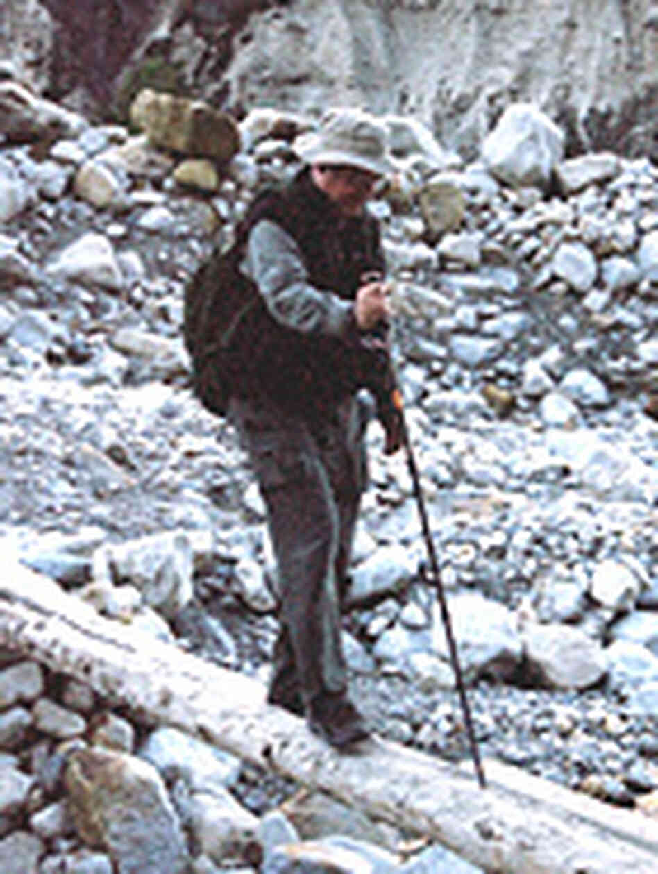 Neal Jackson crosses a log bridge. Neal Jackson crosses a log bridge.