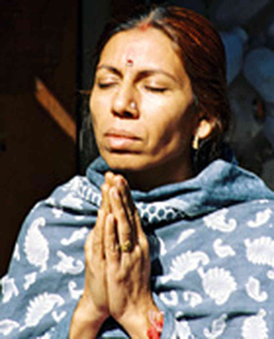 A Hindu woman praying A Hindu woman praying