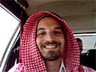Raz in a red-checked keffiyah.