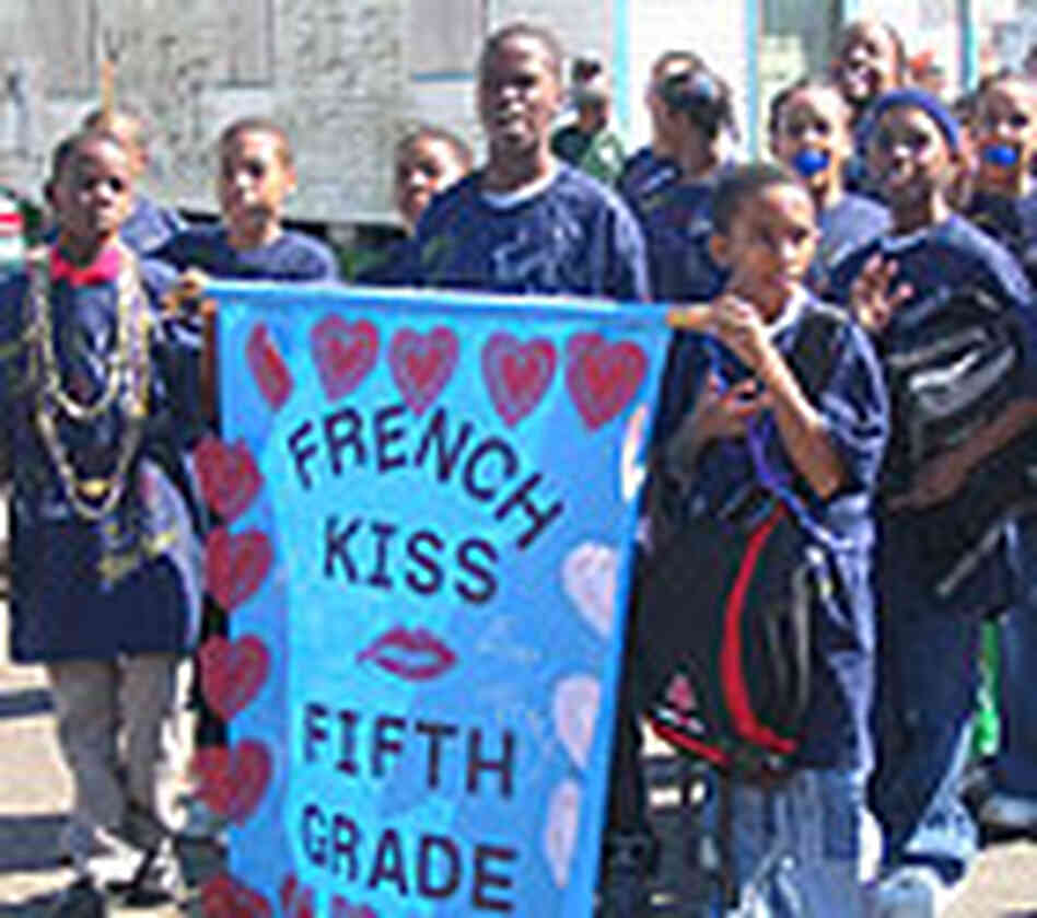 A group of kids unite under the banner "French Kiss, Fifth Grade." A group of kids unite under the banner "French Kiss, Fifth Grade."