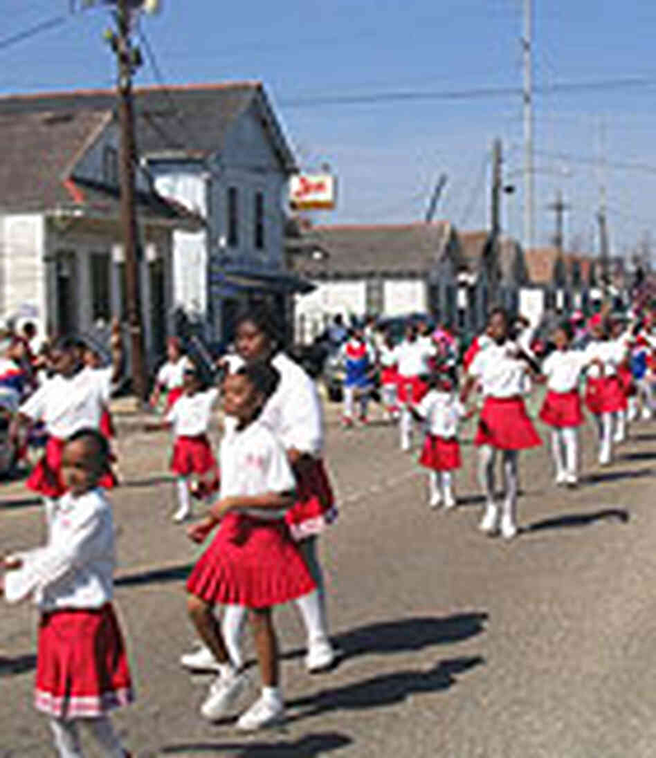 Majorettes on the march during a Mardi Gras parade. Majorettes on the march during a Mardi Gras parade.