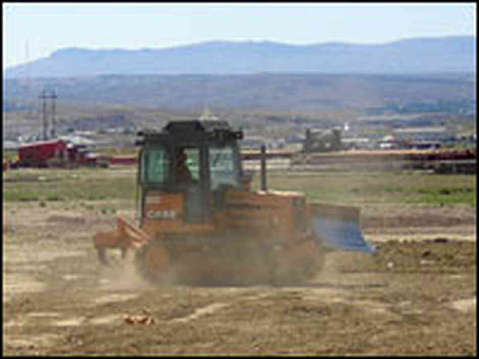 A bulldozer clears rock and sagebrush to make way for new construction in Rock Springs, Wyo. A bulldozer clears rock and sagebrush to make way for new construction in Rock Springs, Wyo.