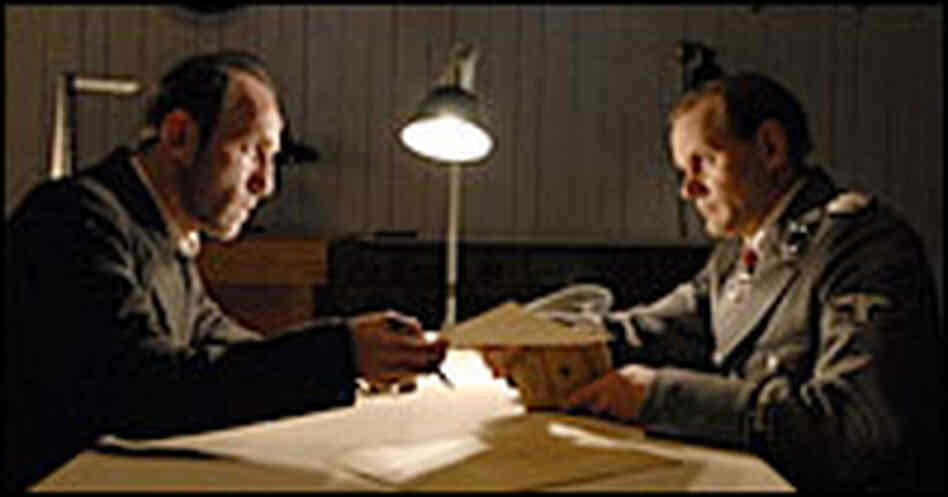 Karl Markovics and Devid Striesow in 'The Counterfeiters.'