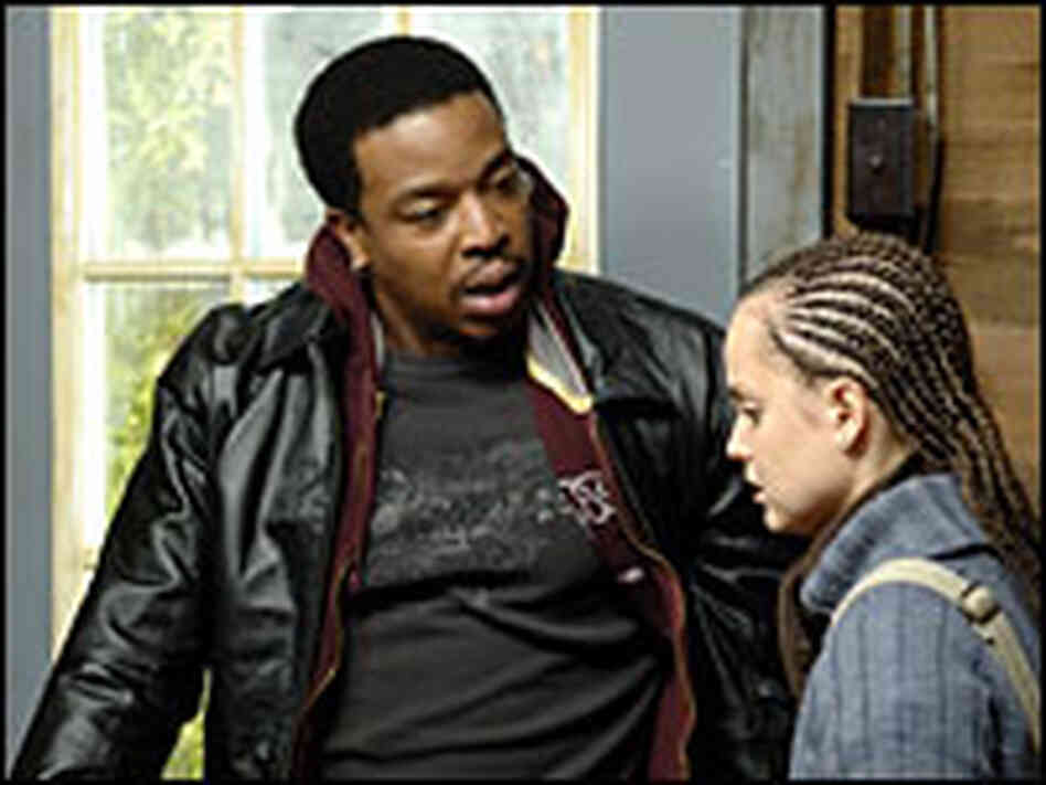 Russell Hornsby and Mena Suvari in 'Stuck'