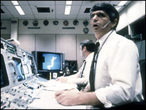 Frederick Gregory (foreground) and Richard O. Covey, spacecraft communicators at Mission Control in Houston, watch helplessly as the shuttle Challenger explodes on Jan. 28, 1986.