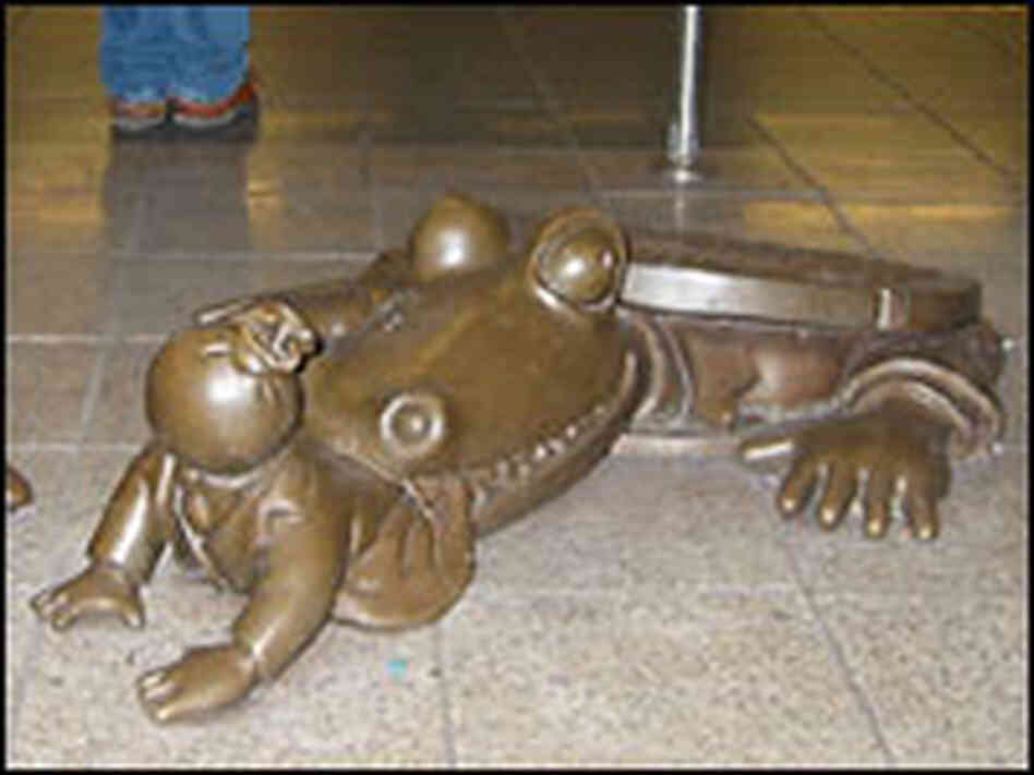bronze alligator emerges from a manhole bronze alligator emerges from a manhole