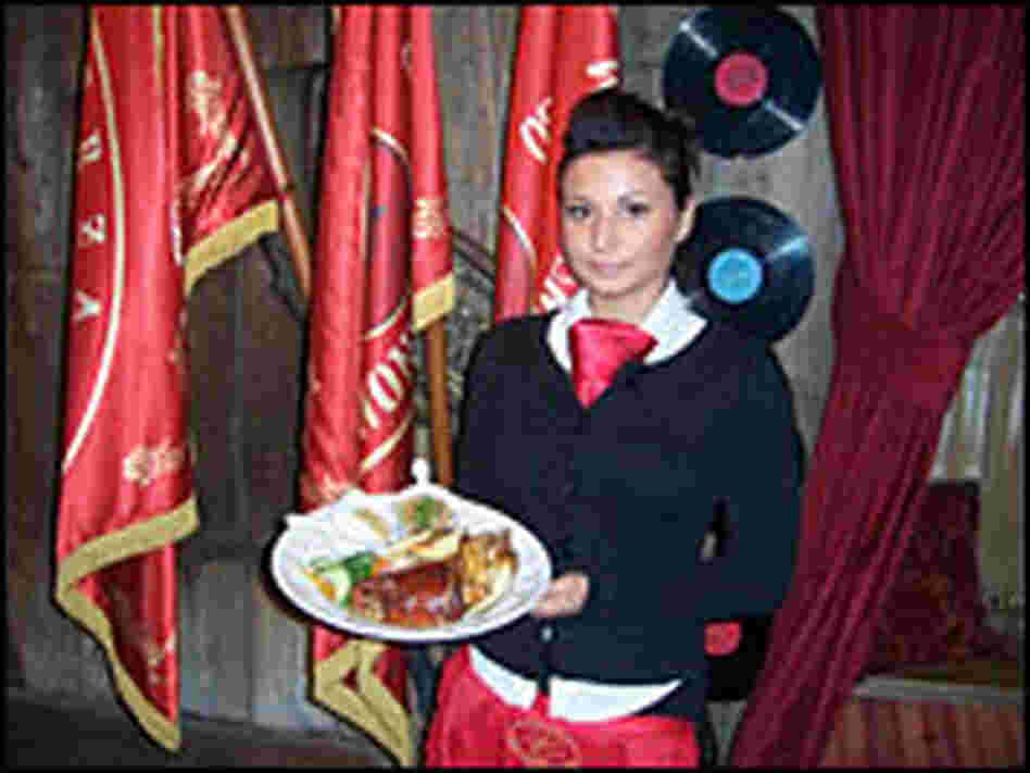 Wait staff clad in red ties are part of the Communist-era theme at Inn Under the Red Hog.