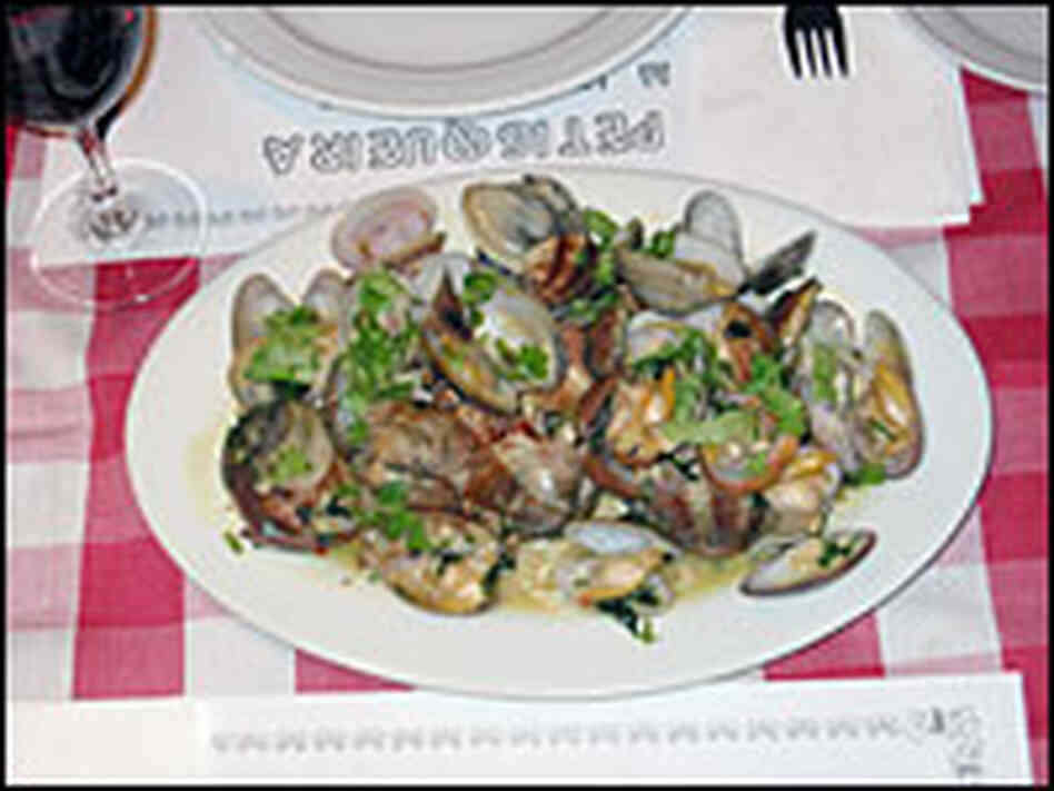 A huge plate of clams, spiced with garlic and cilantro, make a nice starter