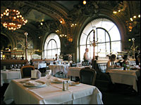 Le Train Bleu's elegant dining room, which dates back to 1901, also features leather-upholstered banquettes, a parquet floor, brass fixtures and crystal chandeliers.