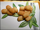 Yam croquettes stuffed with double-cooked pork masquerade as pipa fruits. Yam croquettes stuffed with double-cooked pork masquerade as pipa fruits.