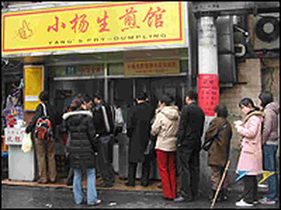A line of people waits outside Yang's Fried Dumpling in Shanghai
