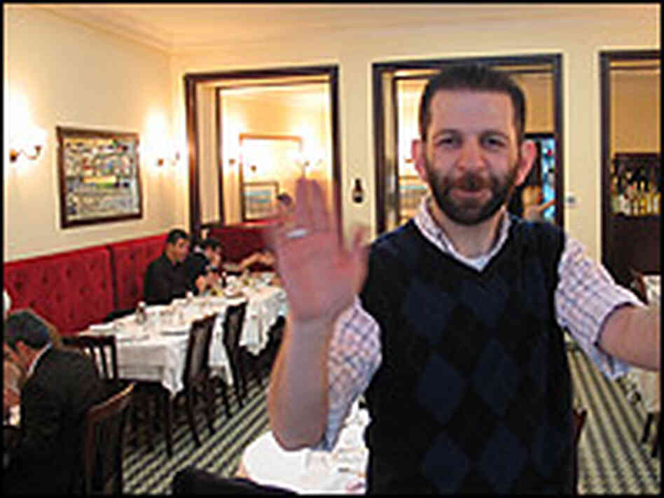 Owner Oral Kurt greets newcomers at the door to his Istanbul restaurant, Karakoy Lokantasi.