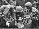 U.S. soldier in Vietnam supervises the waterboarding of a captured North Vietnamese soldier. U.S. soldier in Vietnam supervises the waterboarding of a captured North Vietnamese soldier.