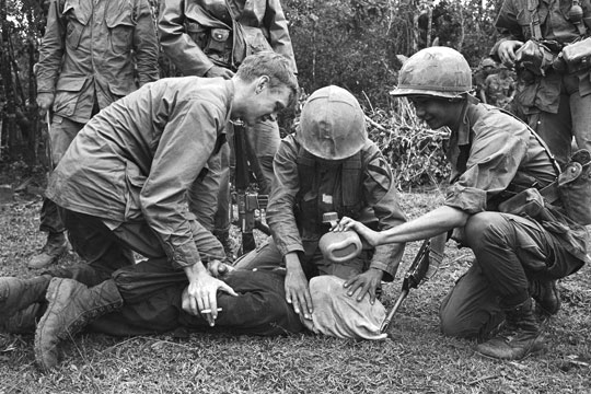 U.S. soldier in Vietnam supervises the waterboarding of a captured North Vietnamese soldier.