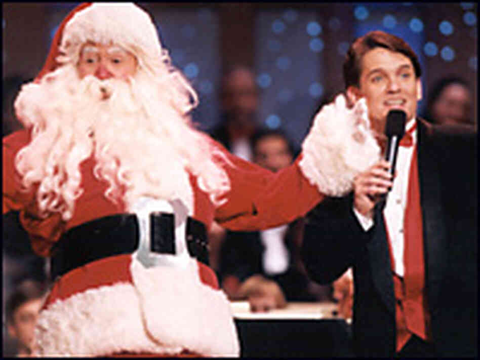 Santa Claus celebrates the holidays with Boston Pops conductor Keith Lockhart. Santa Claus celebrates the holidays with Boston Pops conductor Keith Lockhart.