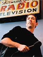 Joe Richman holding a microphone