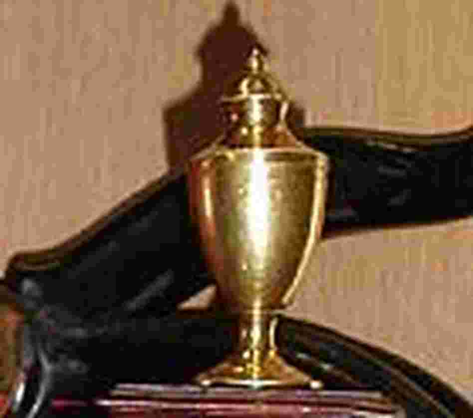A three-inch gold urn silversmith Paul Revere made upon George Washington's death. A three-inch gold urn silversmith Paul Revere made upon George Washington's death.