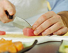 A chef prepares tuna.