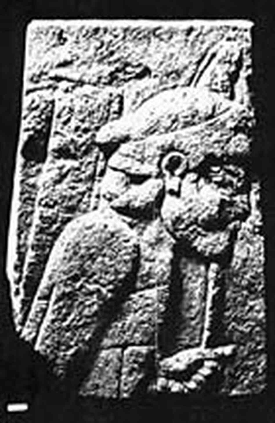 A fragment of the slab, showing an Assyrian archer marching into battle. A fragment of the slab, showing an Assyrian archer marching into battle.