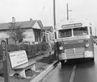 A mostly empty Baton Rouge city bus pulls up to an empty bus stop at the start of the June 20, 1953, bus boycott.