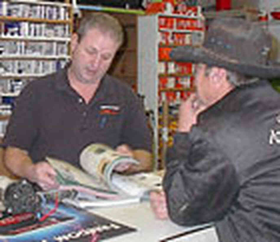 Beaver Mayor Wade Bradshaw tends to a customer at his auto parts store. Beaver Mayor Wade Bradshaw tends to a customer at his auto parts store.