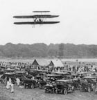 Orville Wright and Lieutenant Lahm of the U.S. Signal Corps fly over Fory Myer in 1908