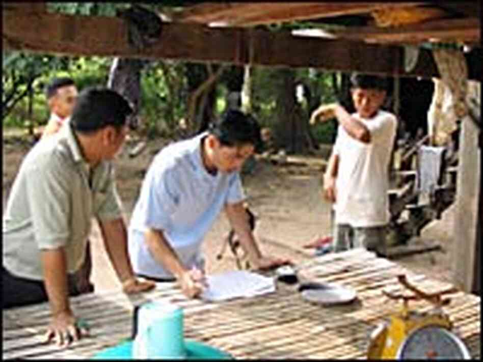 Wicharnchai Piengphon and a regional official Wicharnchai Piengphon and a regional official