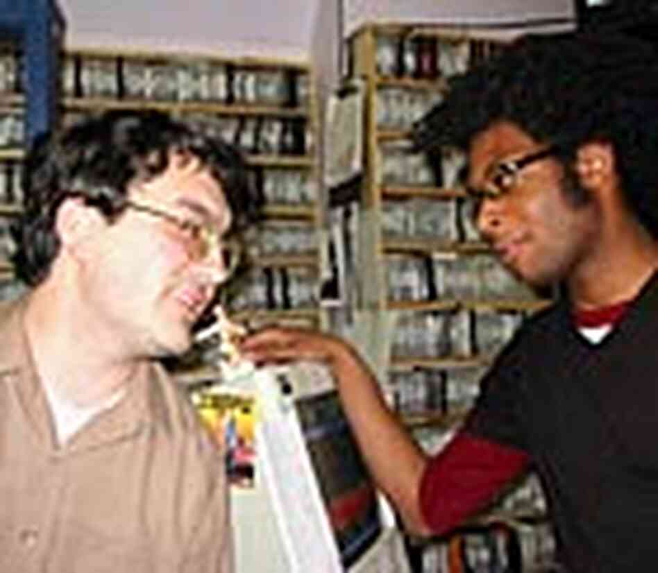 Scott Mueller, left, and Adam Robinson at the Washington, D.C., video store where they work. Scott Mueller, left, and Adam Robinson at the Washington, D.C., video store where they work.