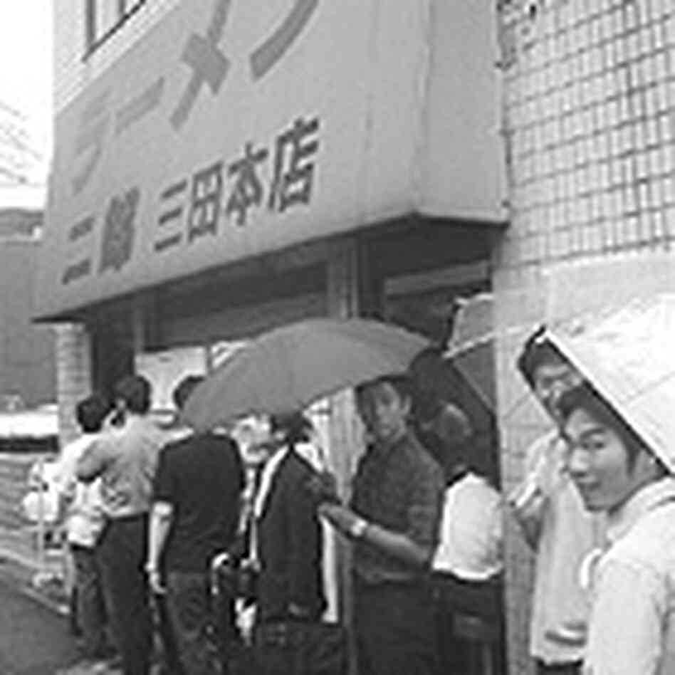Men line up outside Ramen Jiro in Tokyo. Men line up outside Ramen Jiro in Tokyo.