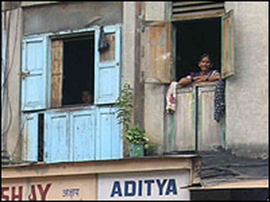 A sex worker looks out onto Bombay's Falkland Road. A sex worker looks out onto Bombay's Falkland Road.
