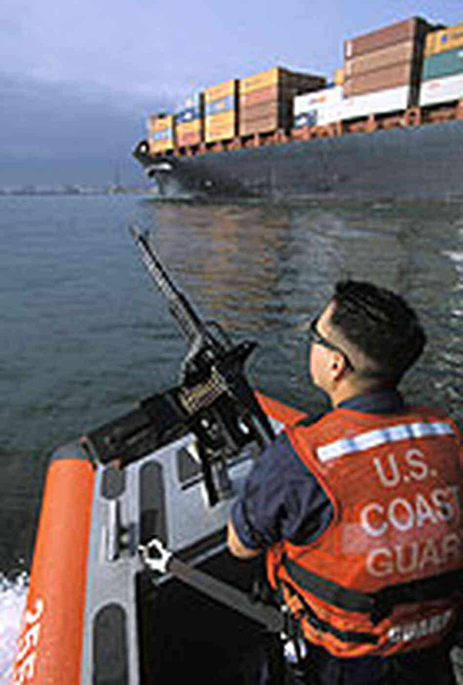 A Coast Guard patrol monitors container ships at the Los Angeles and Long Beach port complex. A Coast Guard patrol monitors container ships at the Los Angeles and Long Beach port complex.