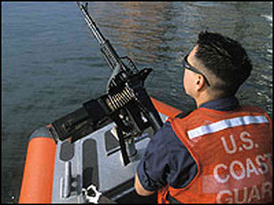 A Coast Guard patrol monitors container ships at the Los Angeles and Long Beach port complex. A Coast Guard patrol monitors container ships at the Los Angeles and Long Beach port complex.