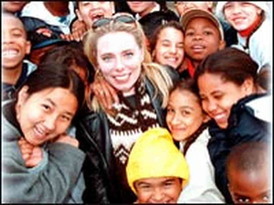 Johanna Grussner, pictured with members of the P.S. 86 choral group. Johanna Grussner, pictured with members of the P.S. 86 choral group.