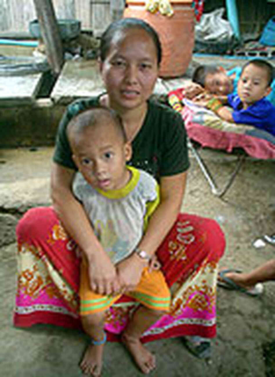 Thao Mai Yia, with some of her seven boys inside their home Thao Mai Yia, with some of her seven boys inside their home