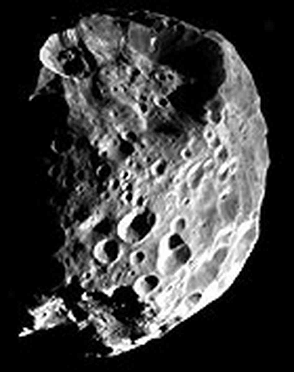 A view of Saturn's moon Phoebe, taken during the Cassini spacecraft's June 11, 2004 flyby. A view of Saturn's moon Phoebe, taken during the Cassini spacecraft's June 11, 2004 flyby.