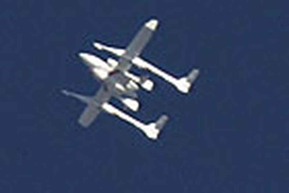 SpaceShipOne, attached to the plane WhiteKnight, during its June 21, 2004 launch. SpaceShipOne, attached to the plane WhiteKnight, during its June 21, 2004 launch.