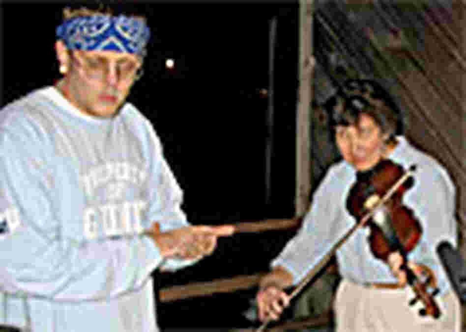 Hill Hop rapper Delivery and fiddler Beverly May rehearse on the porch at Appalshop Hill Hop rapper Delivery and fiddler Beverly May rehearse on the porch at Appalshop