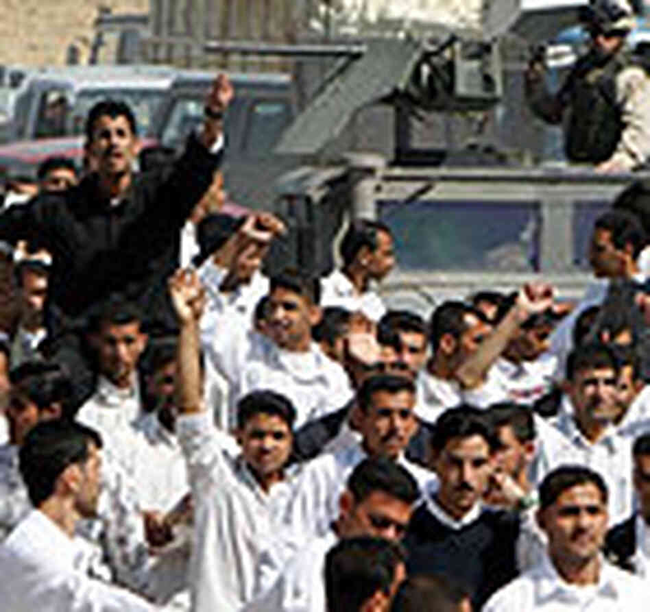 Iraqi students protest the country's newly signed interim constitution. Iraqi students protest the country's newly signed interim constitution.