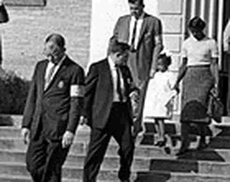 U.S. marshals escort six-year-old Ruby Bridges at William Frantz Elementary School. U.S. marshals escort six-year-old Ruby Bridges at William Frantz Elementary School.