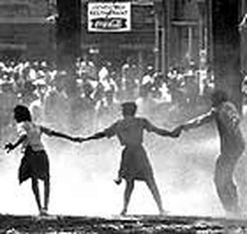 Riot police hose student protestors in Birmingham, May 1963 Riot police hose student protestors in Birmingham, May 1963