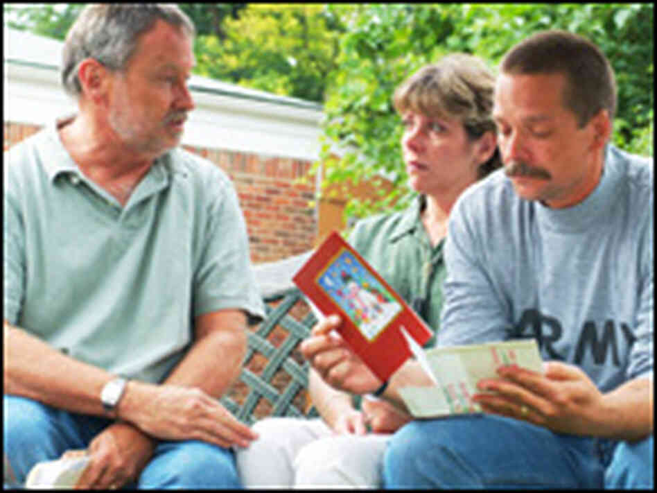 Director Bill Couturié talks with Paula and Michael Zasadny, parents of Pfc. Holly McGeogh. Director Bill Couturié talks with Paula and Michael Zasadny, parents of Pfc. Holly McGeogh.