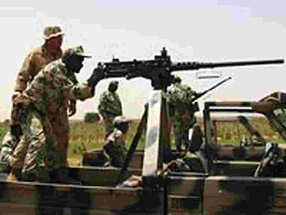 Marine Staff Sgt. Jonathan Sparkman instructs troops in Niger on use of a .50-caliber machine gun. Marine Staff Sgt. Jonathan Sparkman instructs troops in Niger on use of a .50-caliber machine gun.