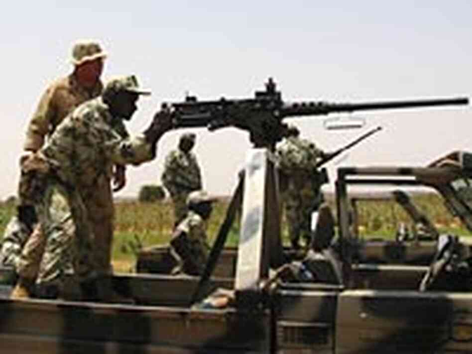 Marine Staff Sgt. Jonathan Sparkman instructs troops in Niger on use of a .50-caliber machine gun. Marine Staff Sgt. Jonathan Sparkman instructs troops in Niger on use of a .50-caliber machine gun.