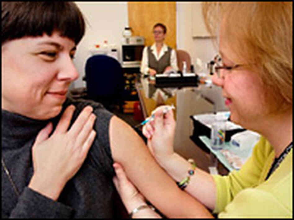 Pascale Krumm receives a flu vaccine from CDC Staff Nurse, Mollie McDonald-Waldron. Pascale Krumm receives a flu vaccine from CDC Staff Nurse, Mollie McDonald-Waldron.