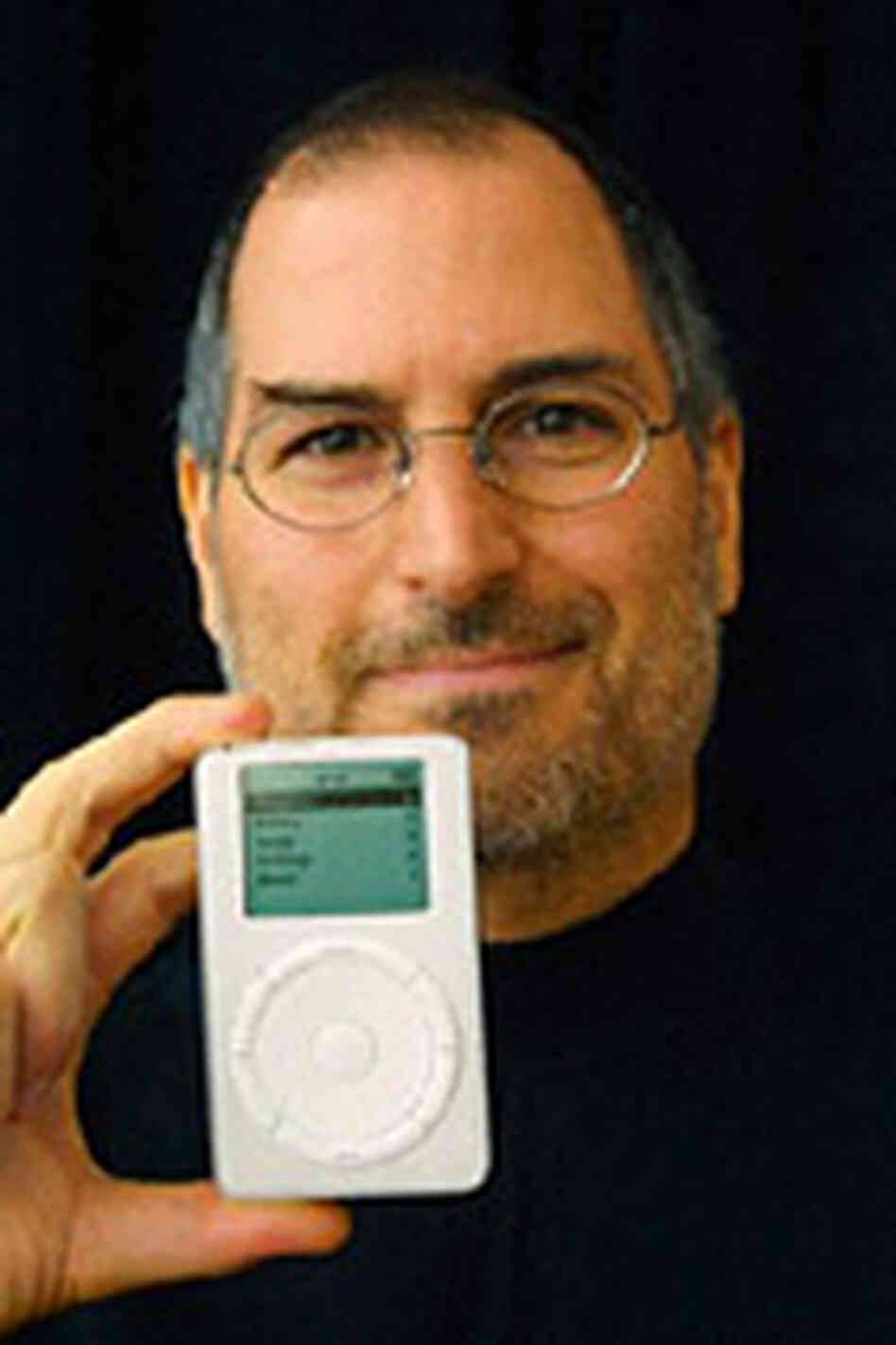 Apple CEO Steve Jobs with the first-generation iPod, introduced in 2001. Apple CEO Steve Jobs with the first-generation iPod, introduced in 2001.