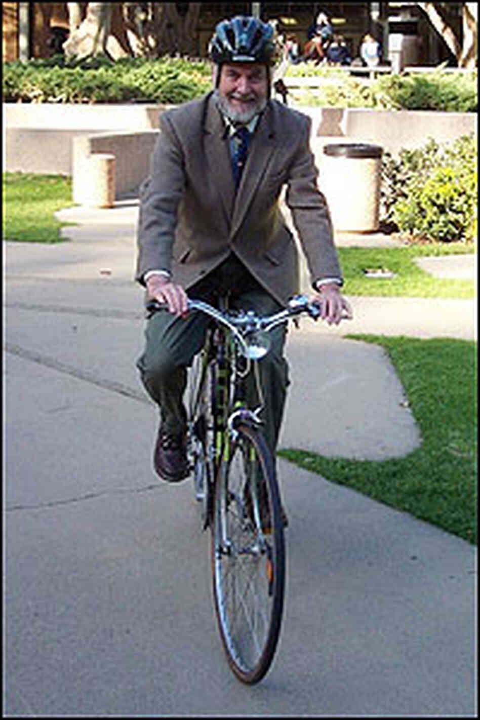 Donald Shoup on a bicycle. Donald Shoup on a bicycle.