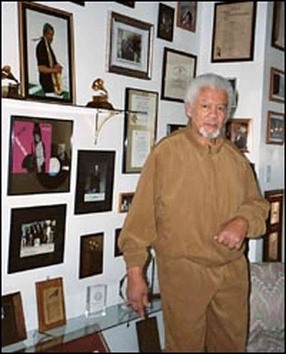 Frank Foster, with photos, awards and mementos at his Virginia home.